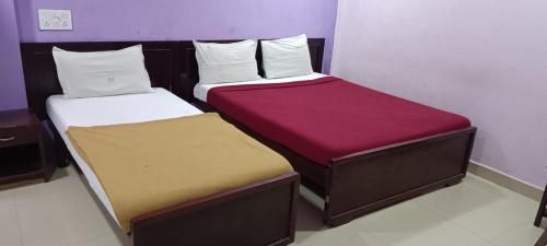 Cama o camas de una habitación en Delmon Residency