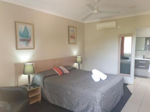A bed or beds in a room at Cobar Central Motor Inn