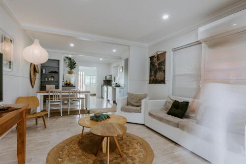a living room with a couch and a table at Yeppoon Surfside Motel in Yeppoon