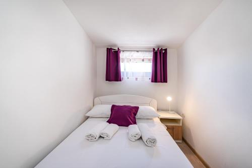 מיטה או מיטות בחדר ב-Villa Tome