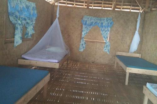 a room with two bunk beds and a canopy at Tribe Banua 