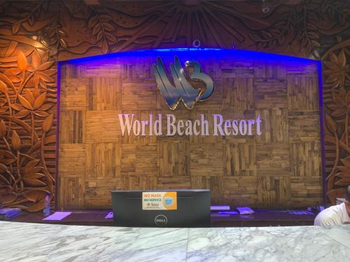 a stage with a world beach resort sign on it at World beach resort in Cox's Bazar