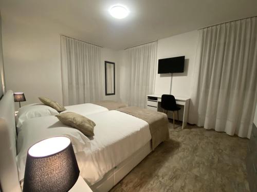 TV a/nebo společenská místnost v ubytování Albergo Stazione