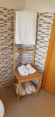 a towel rack in a bathroom with towels at TDC Home in Vallo della Lucania