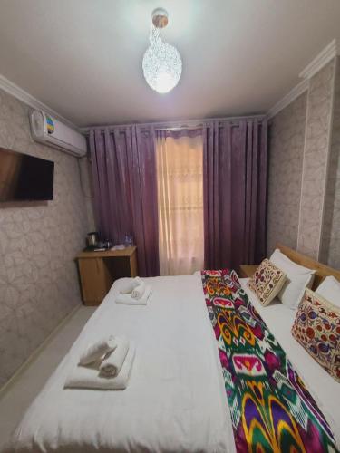 Katil atau katil-katil dalam bilik di Samarkand City Center Hotel