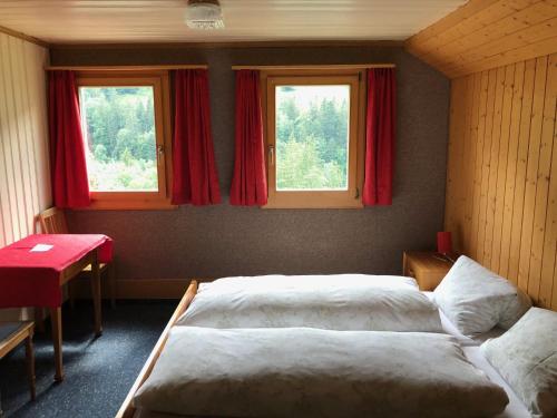 Vuode tai vuoteita majoituspaikassa Hotel Bären Lodge