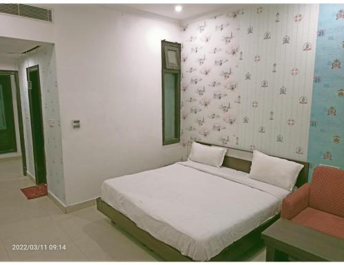 Postelja oz. postelje v sobi nastanitve Hotel Kishore International, Amritsar