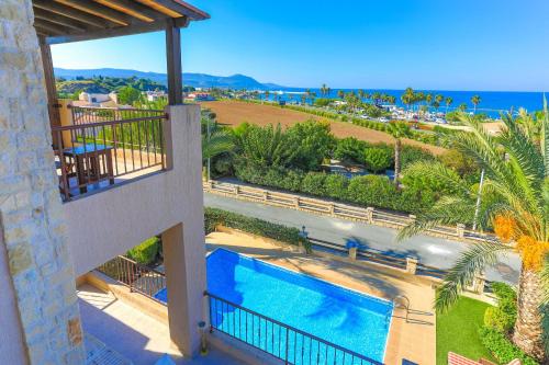 a view of the pool from the balcony of a resort at Villa Arbanassi in Lachi