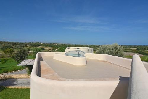 a view of a swimming pool from a house at Villa Vendicari in Casa Maccari