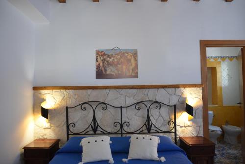 Postel nebo postele na pokoji v ubytování B&B Antico Palmento