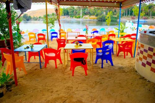 a group of tables and chairs in a tent at Hamo Guest House in Aswan