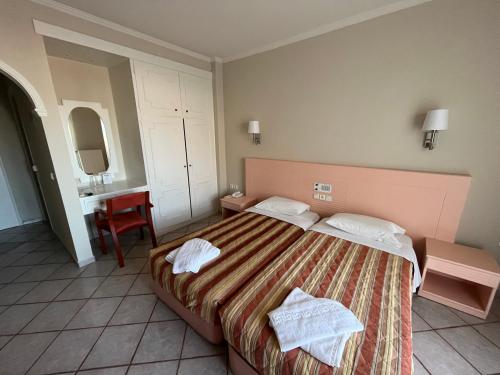 Postel nebo postele na pokoji v ubytování Philoxenia