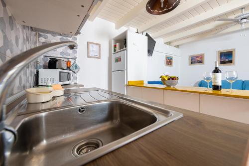 Kuchyňa alebo kuchynka v ubytovaní Mammanico Apartament