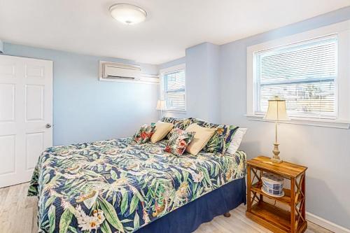 a bedroom with a bed and a window at First Street Retreat Lower in Mexico Beach