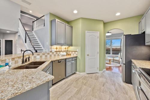 a kitchen with a sink and a counter top at Family-friendly Home on Boyd Lake, Gorgeous Views! in Loveland