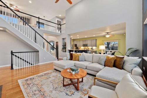 a living room with a couch and a table at Family-friendly Home on Boyd Lake, Gorgeous Views! in Loveland
