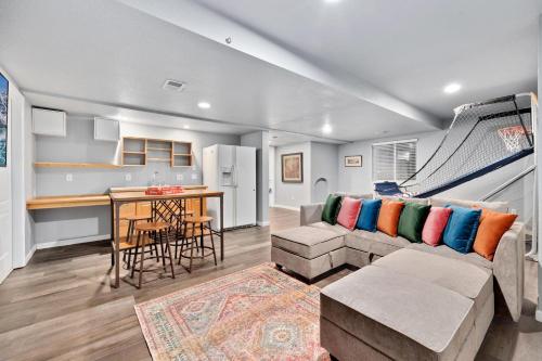 a living room with a couch and a table at Family-friendly Home on Boyd Lake, Gorgeous Views! in Loveland