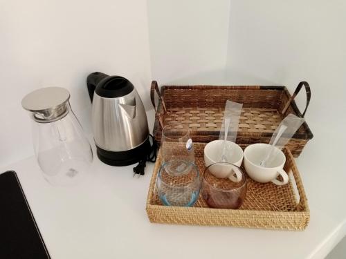 a basket on a counter with bowls and other items at Bathala Resort in Panglao
