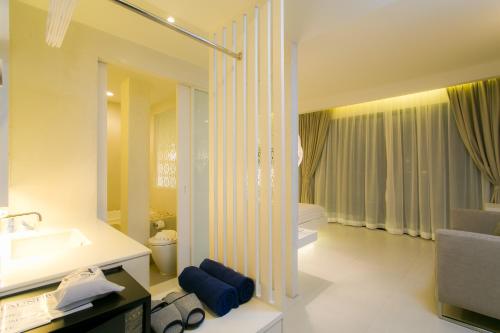Ένα ή περισσότερα κρεβάτια σε δωμάτιο στο The House Patong