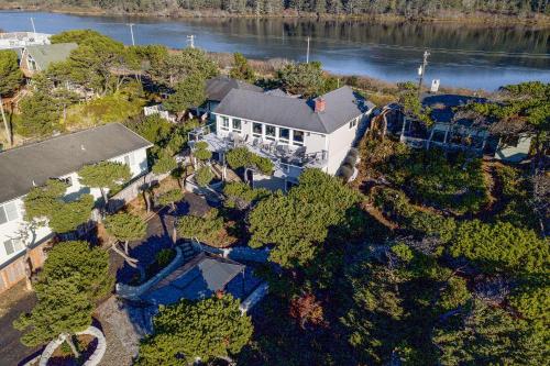 an overhead view of a house with trees and water at Loki's Kingdom in Rockaway Beach