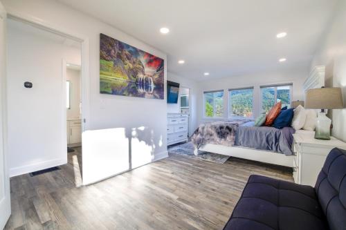 a bedroom with a bed and a large painting on the wall at Loki's Kingdom in Rockaway Beach
