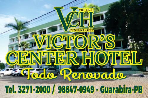 a sign for actors center hotel in front of a building at Victor's Center Hotel in Guarabira