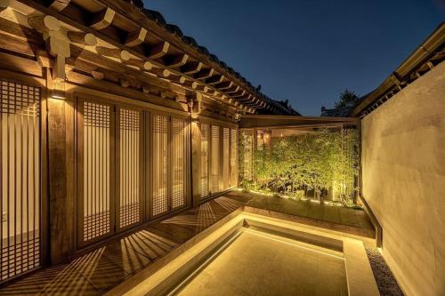 a balcony of a house with a swimming pool at Present Stay in Jeonju