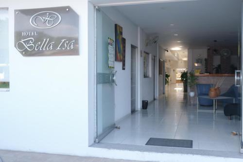 a glass door of a building with a bike use sign at Hotel Bella Isa in La Dorada