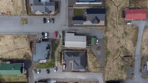 an overhead view of a parking lot with houses and cars at Tórshavn Apartment - Great View in Tórshavn