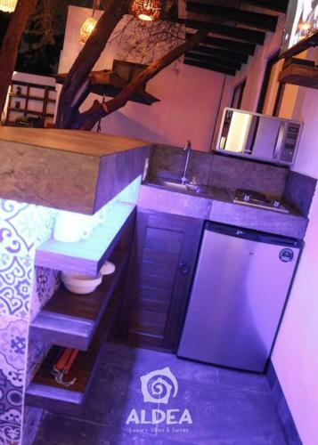 a small kitchen with a sink and a toilet at VILLA HUIZACHE ALBERCA PRIVADA+EXCLUSIVIDAD+LUJO in San Martín de las Pirámides