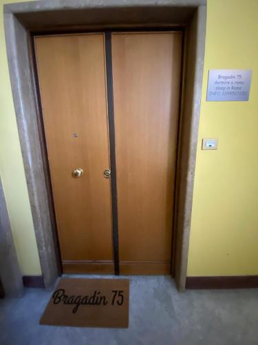 a room with two doors and a sign that reads riparian at Bragadin75 In Vaticano in Rome