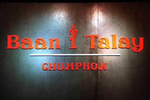 a neon sign that reads benjamin talley chowder at Baan i Talay Chumphon บ้านไอทะเลชุมพร in Chumphon