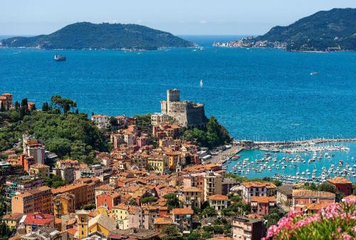 an aerial view of a city and the ocean at Marinella House in Sarzana