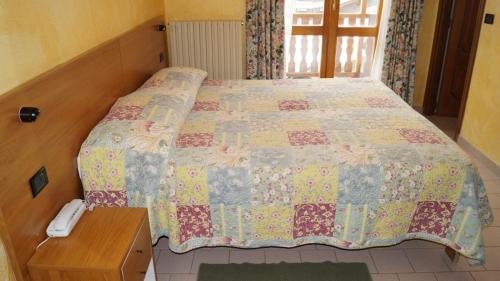 Posteľ alebo postele v izbe v ubytovaní Hotel Chateau des Dames