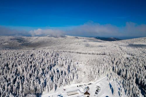an aerial view of a snow covered mountain at Horský hotel Paprsek in Staré Město