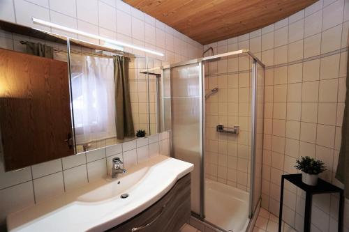 a bathroom with a sink and a shower at Apart Lisa in Huben