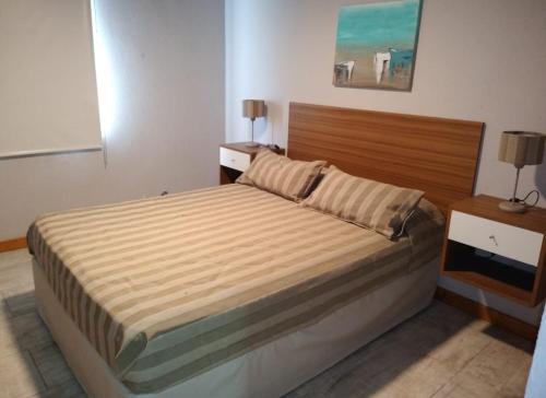 Una cama o camas en una habitación de Complejo Rafina Villa Gesell
