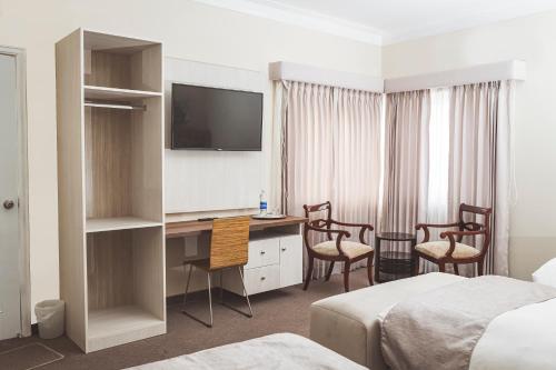 Un pat sau paturi într-o cameră la Hostal Lirium