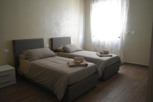 Katil atau katil-katil dalam bilik di Armonia family B&b
