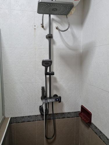 a shower in a bathroom with a shower head at khampiane hotel in Ban Nongdouang