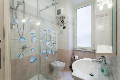 a bathroom with a shower and a toilet and a sink at Anzio- central holiday house - Daniele Case Vacanza in Anzio