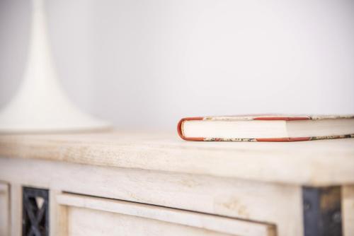 a book sitting on top of a table at Blue Waves Suites & Apartments in Kamari