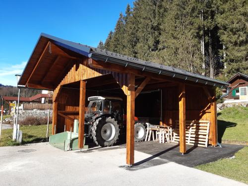 a tractor in a barn with a tractor inside at Haus Margarete in Lackenhof