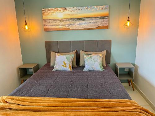 Letto o letti in una camera di Mangata Loft - Requinte e Conforto para Lazer ou Trabalho