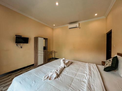 Cama o camas de una habitación en Gayatri Bungalows