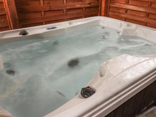 a jacuzzi tub filled with water at The Red in St Asaph