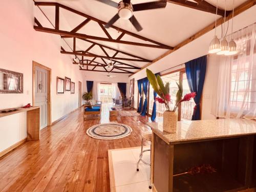 a large living room with wooden floors and ceilings at Casa Le Parc - Main Street in Bocas del Toro