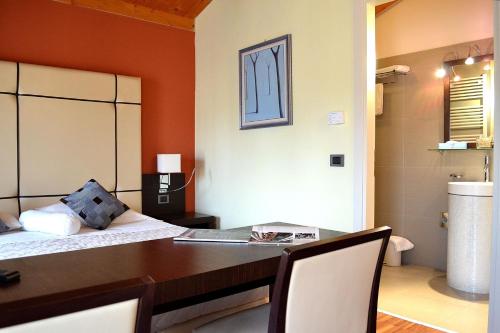 Postel nebo postele na pokoji v ubytování Albergo Minuetto