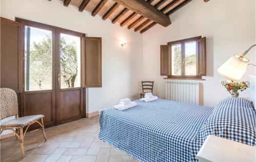 a bedroom with a bed and a table and chairs at La Dependance in Migliano