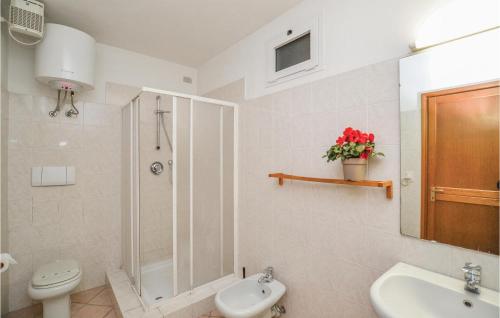 a bathroom with a shower and a toilet and a sink at Lavanda trilo in Caramagna Ligure